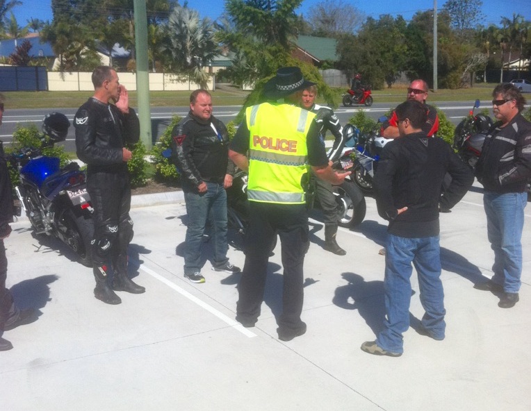 Police talk to riders at a 2016 Operation North Upright event enforce