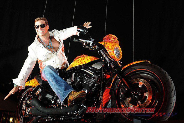 Artist Jack Armstrong unveils his "Cosmic Starship" Harley Davidson on October 21, 2010 in Marina Del Rey, California. Priced at USD one million, this is the world's first and only million dollar Harley. Armstrong was a protege of Andy Warhol and his paintings retail for 300K to 2M USD. AFP PHOTO / GABRIEL BOUYS most expensive blue edition bling