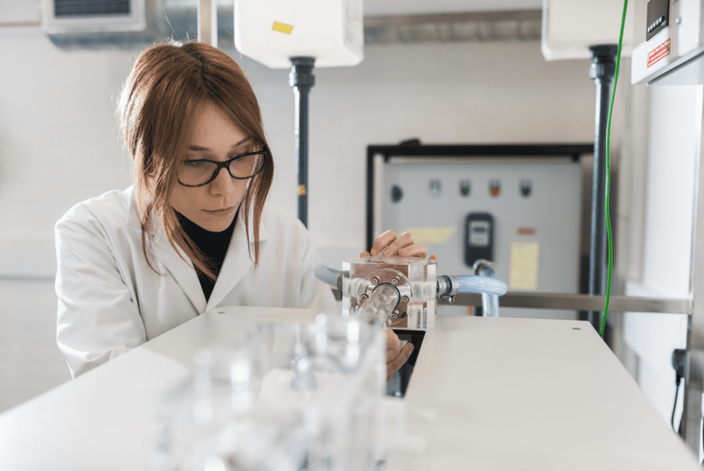 A view of a lab student working at the Advanced Propulsion Center