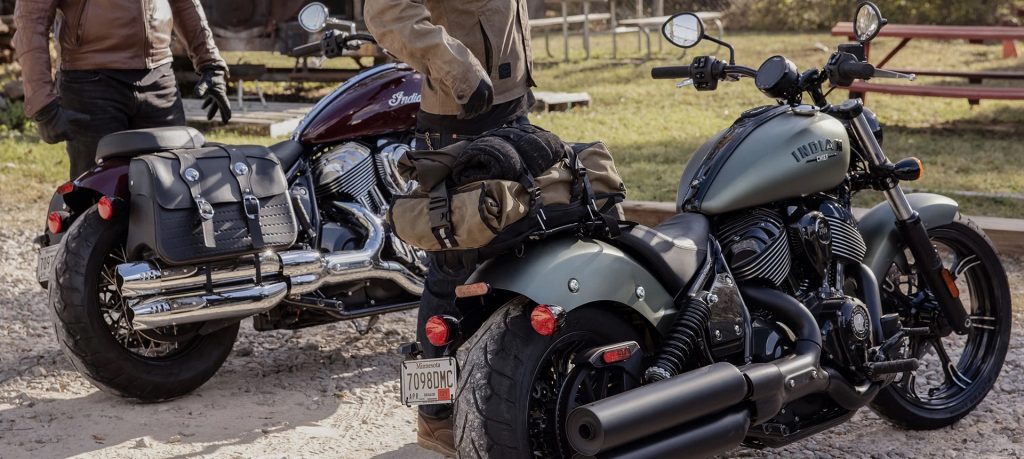 A view of two 2022 Indian Chief Dark Horse motorcycles, with riders enjoying the dusty landscape.