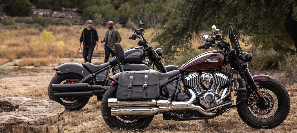 A view of two 2022 Indian Super Chief Limited Edition motorcycles, with riders enjoying the dusty landscape.