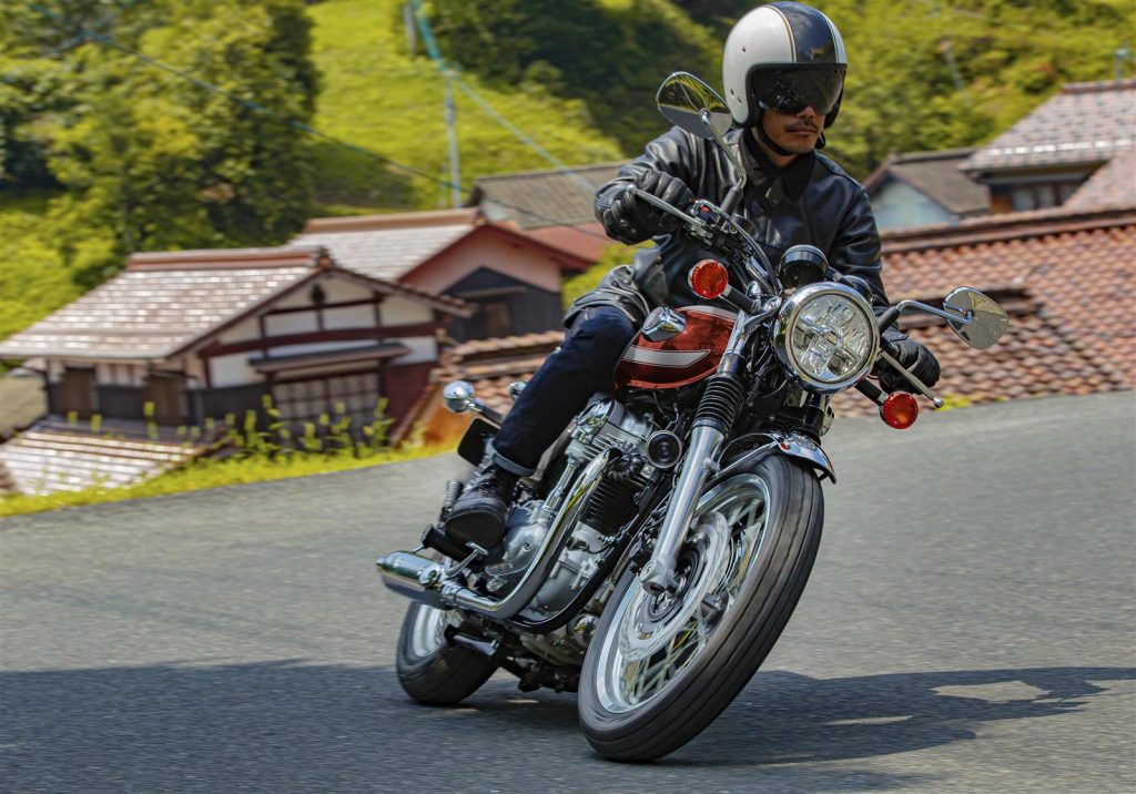 A frontal three-quarter view of a rider enjoying the 2022 Kawasaki W800