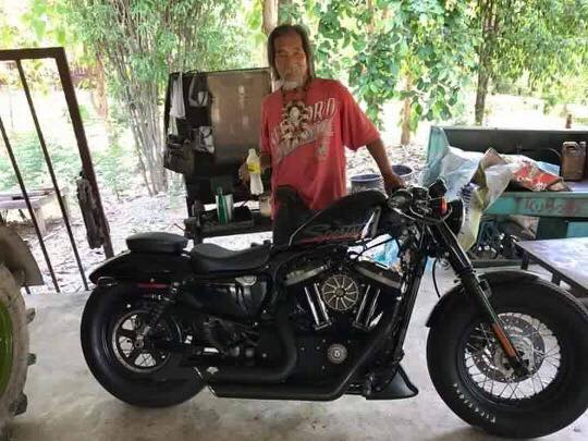 Scruffy customer buys Harley with cash