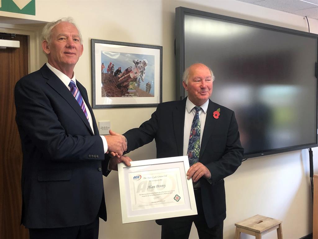 ACU Chairman Roy Humphrey hands out medal of honour to Alan Penny