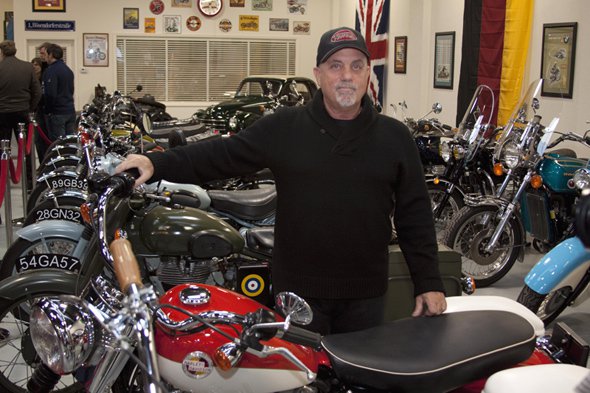 Billy Joel with his collection of custom motorcycles