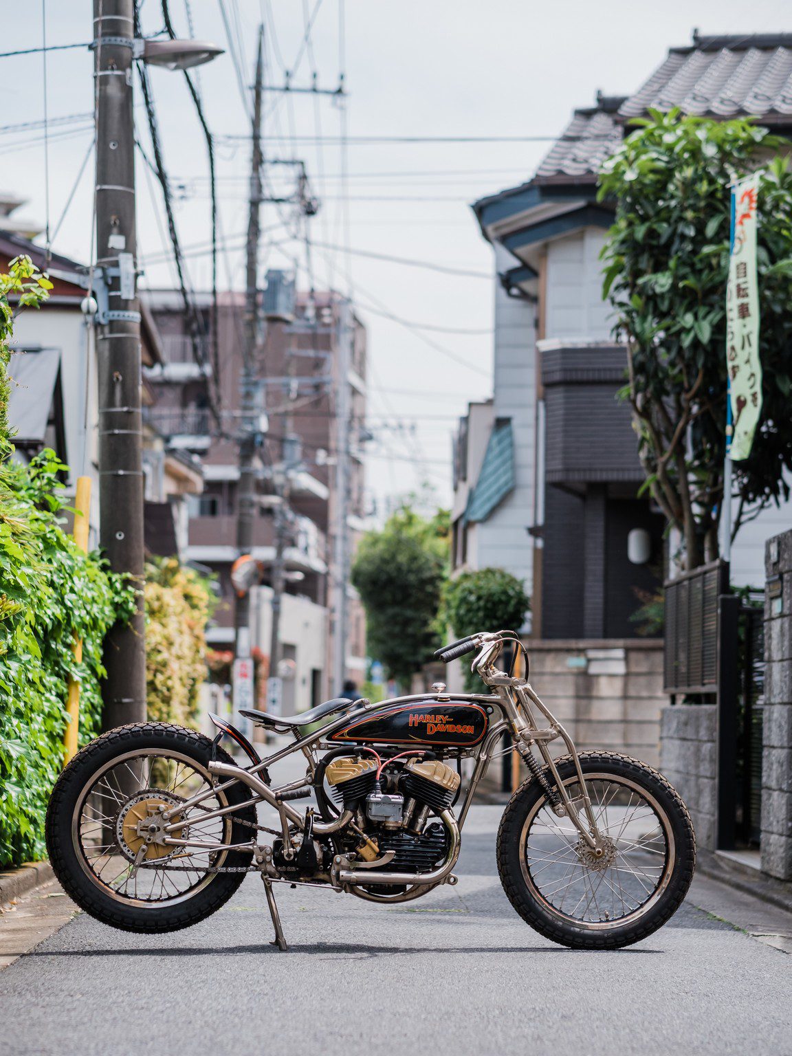 Harley Flathead motorcycle bobber on a street in Japan
