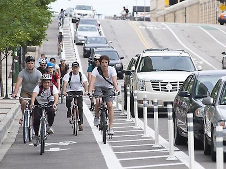 Cyclists in bike lanes ride to work day