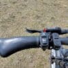 Left side of the handlebar with PAS toggle buttons, headlight, and horn