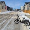 The Kommoda ebike in a neighborhood with snowy roads