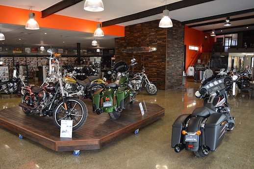 Motorcycle dealer showroom deal customer public listing on ASX