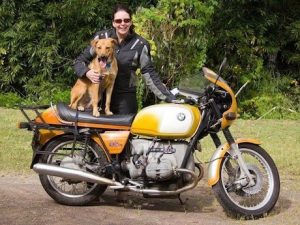 Adventure rider Linda McCall with her dog Dakar and BMW R 90 S Female riders with dog