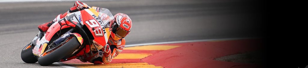 A MotoGP Honda bike leaning into a twisty. Media sourced from HRC.