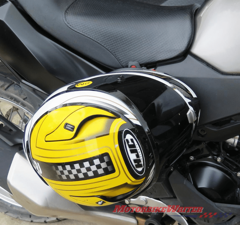 Hang helmet shop on motorcycle