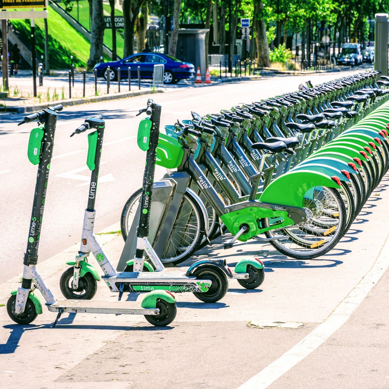 An image of multiple electric bikes and electric scooters parked side by side.