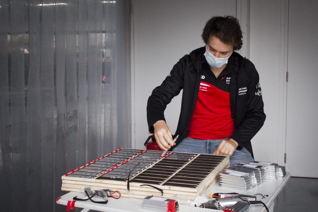 A student from Electric Superbike Twente testing battery components for the new electric Superbike, dubbed the Delta-XE