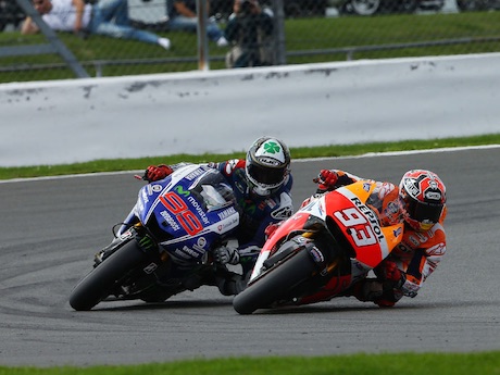 Jorge Lorenzo and Marc Marquez in action motorcycle insurance footpegs