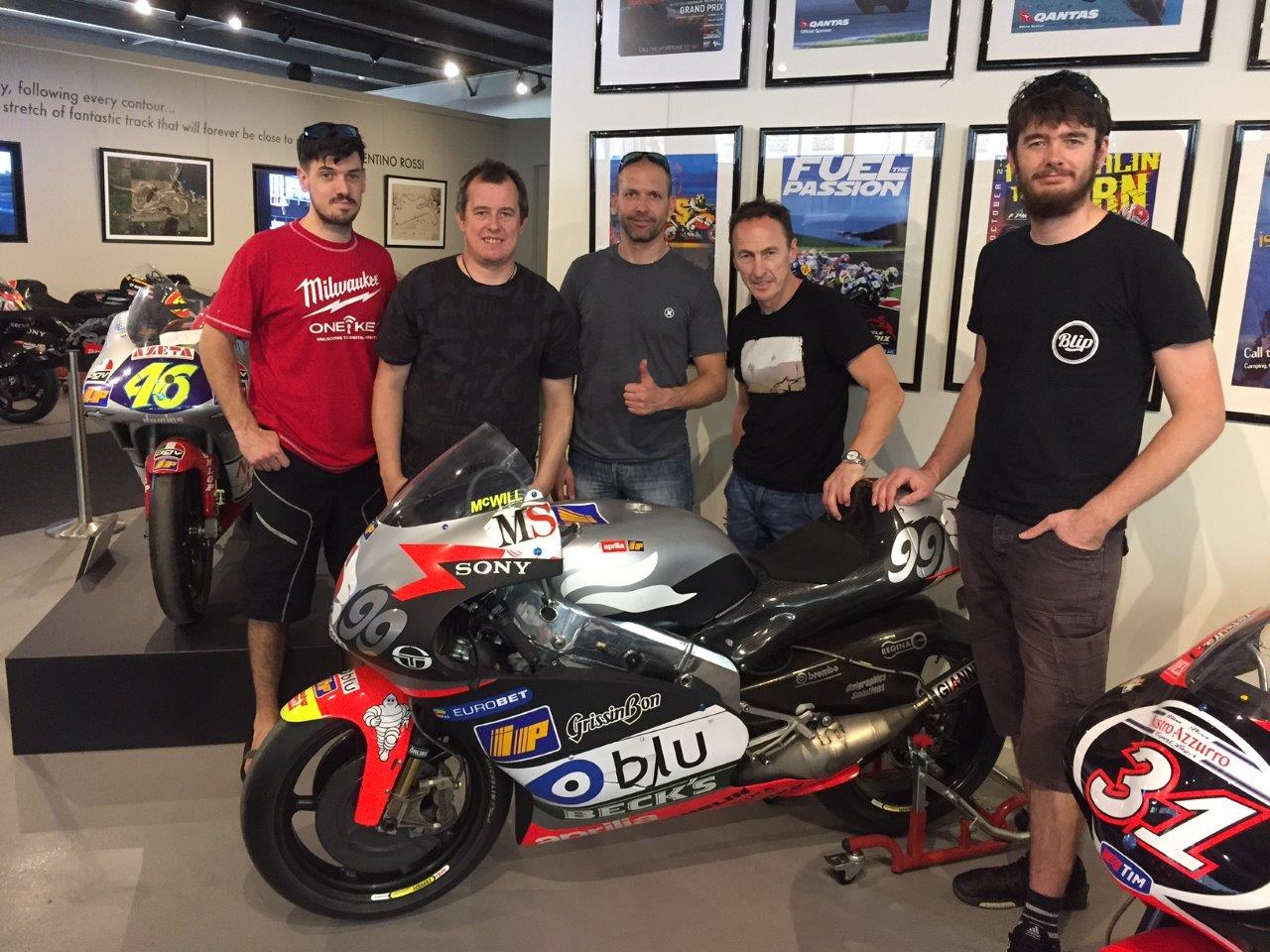 Jeremy McWilliams, John McGuinness and UK IC crew looking at Jeremy's Aprilia RSV500 Grand Prix