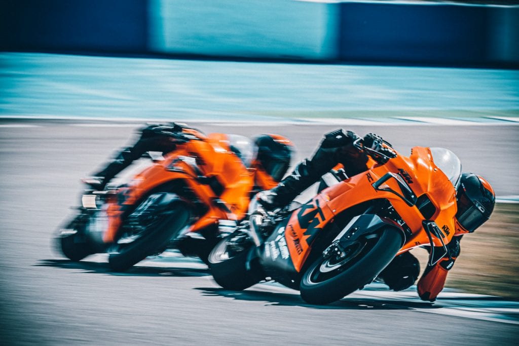 A front view of riders battling on the all-new track-only 2022 KTM RC 8C