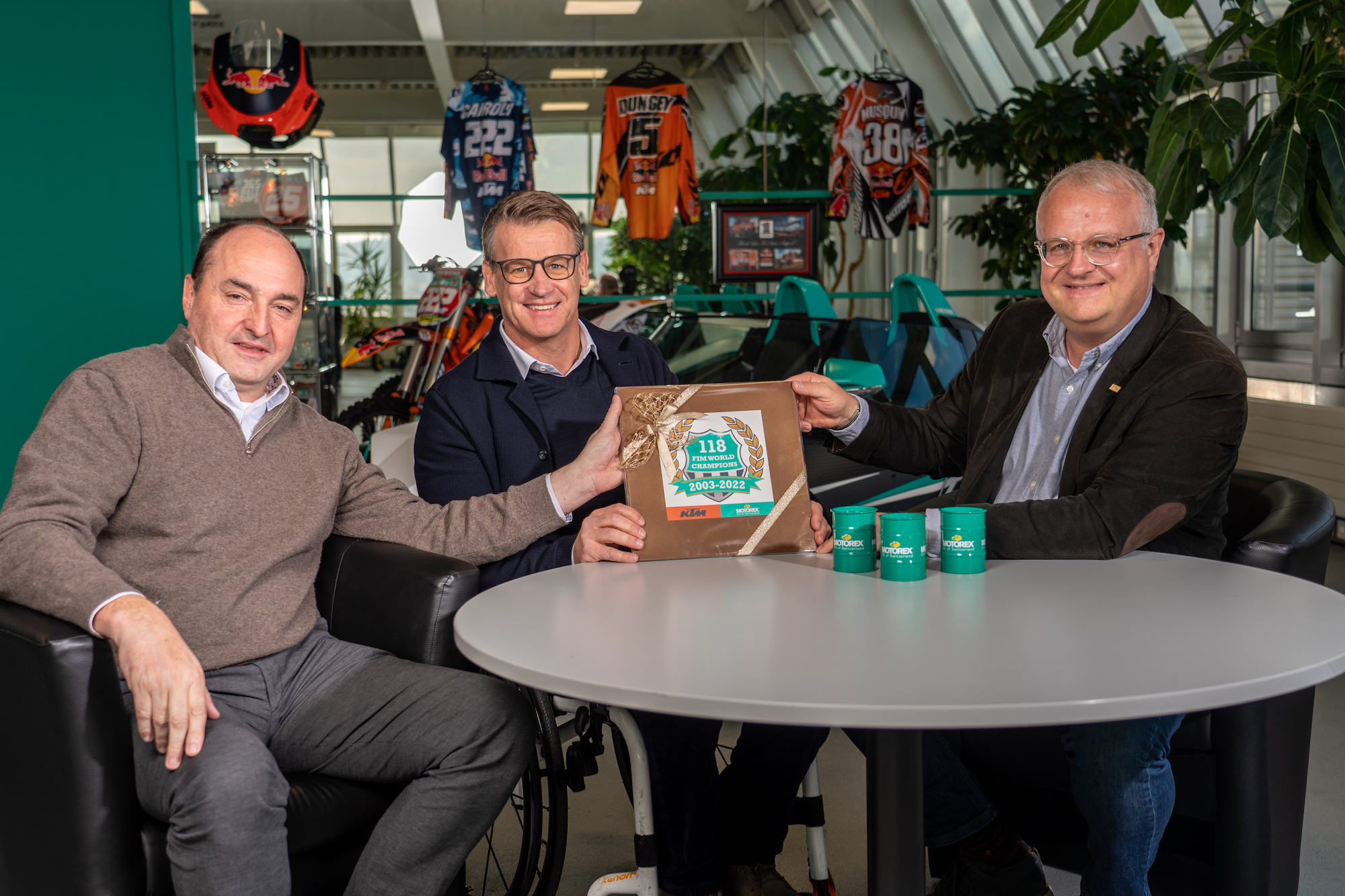 Edi Fischer (CEO MOTOREX AG), Pit Beirer (KTM Director Motorsport), and Ronald Kabella (Director Powersports MOTOREX AG) (from left). Media sourced from Motorex's press release.