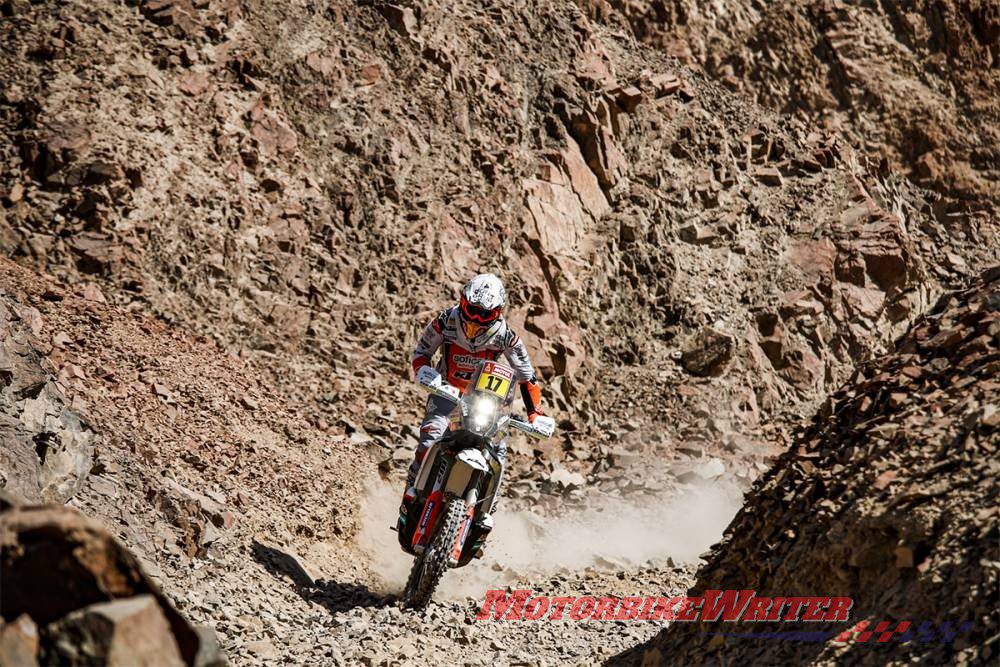 Australia’s first Dakar Rally winner Toby Price is first overall after stage 8, zeroing in on a kiss with KTM Factory teammate Laia Sainz but risking the loss of his mullet.