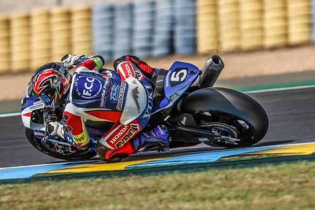 F.C.C. TSR Honda France racer on a bike, turning in to the track's twisties