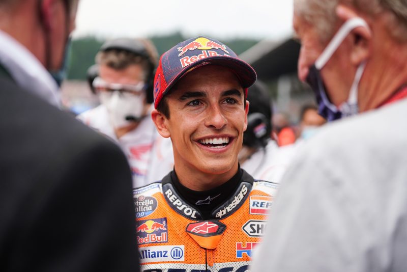 Marquez at the race start speaking to two gentlemen