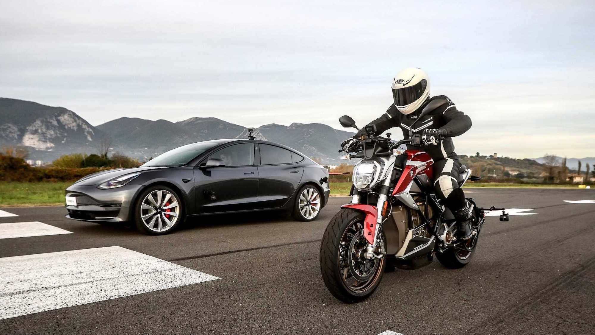 A view of a Tesla Supercharger. Media sourced from RideApart.