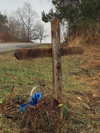 Memorial for rider near the potholes that claimed his life
