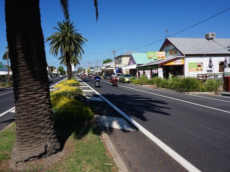 Inglewood's palm-tree-lined main street riders