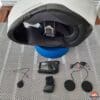 Sena 50C being installed in helmet