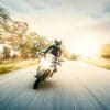 A female motorcyclist enjoying a ride on her motorcycle. Media sourced from Harvard.