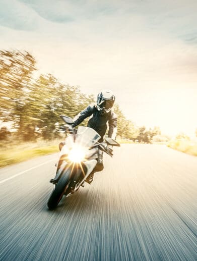 A female motorcyclist enjoying a ride on her motorcycle. Media sourced from Harvard.