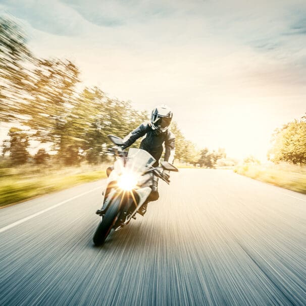 A female motorcyclist enjoying a ride on her motorcycle. Media sourced from Harvard.