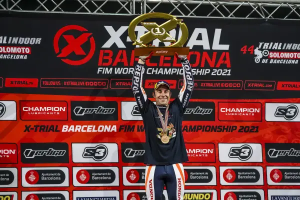 Toni Bou holding up the X-Trials trophy