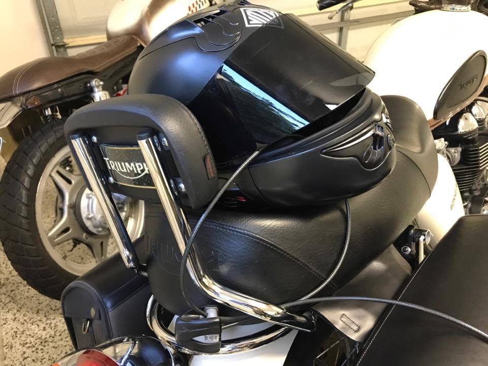 Vozz helmet secured with a wire cable lock ratchet