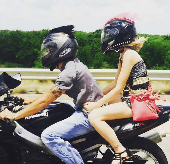 a couple of bikers with mohawks on the helmets