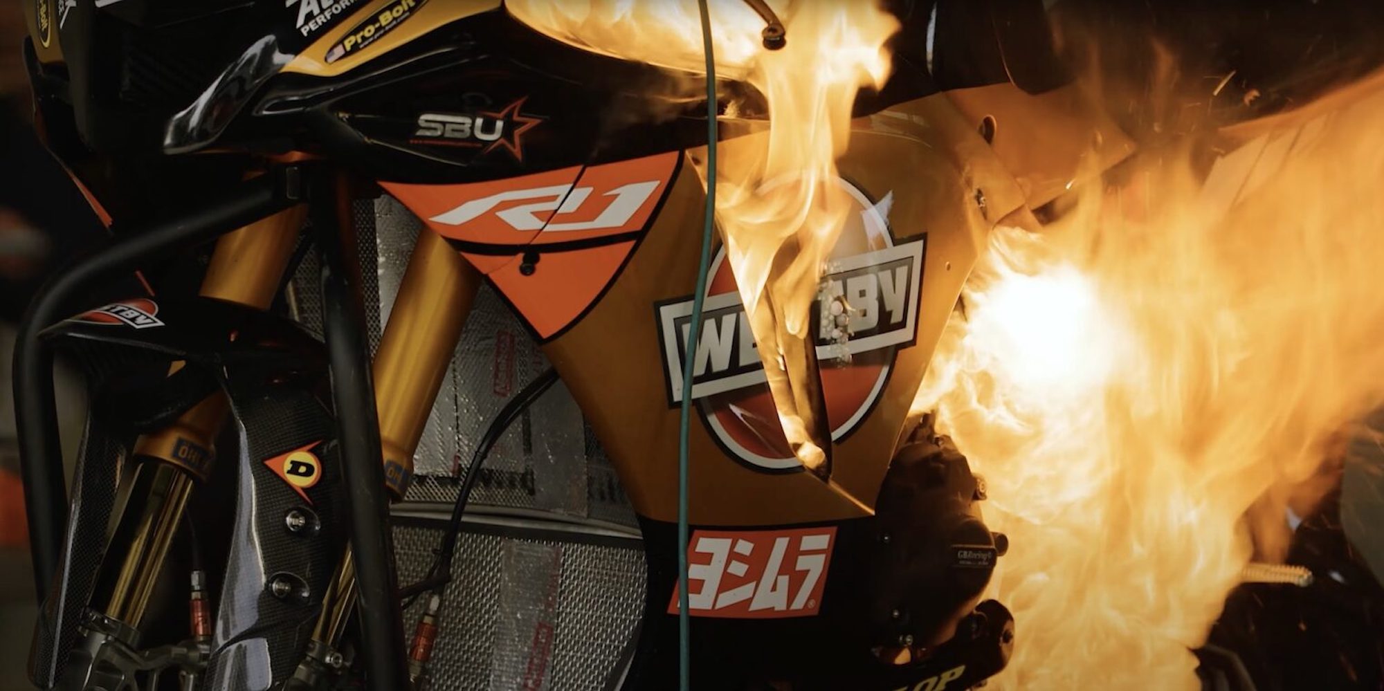 A Westby Racing bike up in flames during a MotoAmerica interview. Media sourced from Youtube. 