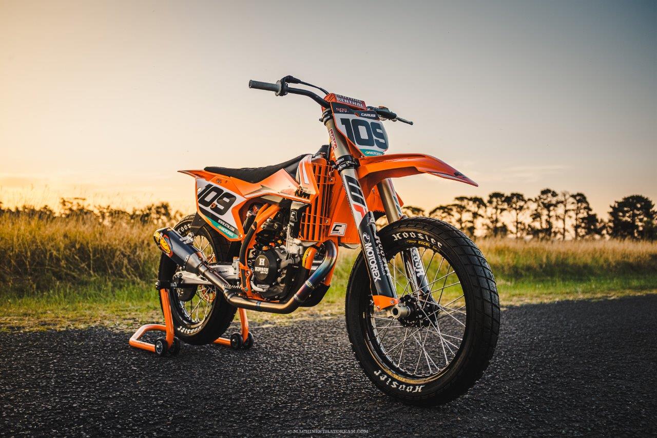 A custom KTM flat tracker on a country lane