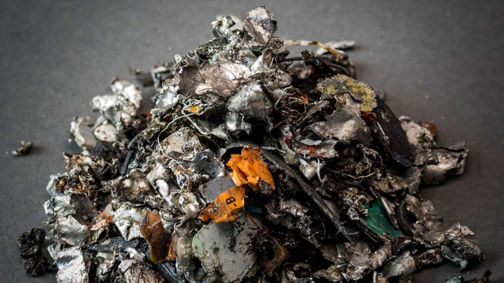 a pile of shredded ReCell Lithium-ion battery waste about to be burned