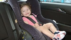 Child restraints caught out by helmet laws