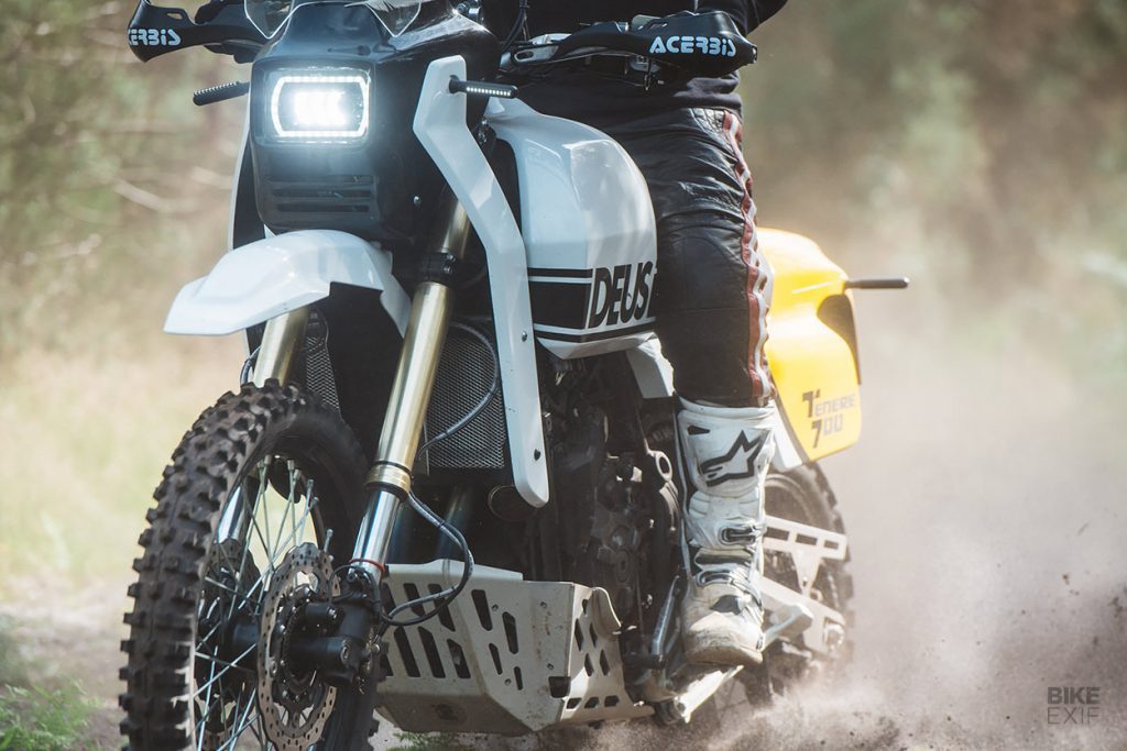 a view of the front of the custom Yamaha Ténéré 700, created by Deus Italia, with a rider trying out the grip of the tyres