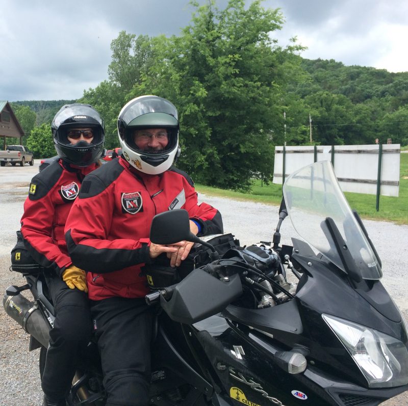 Meditation by Motorcycle author John Metzger and wife Catherine on his Suzuki