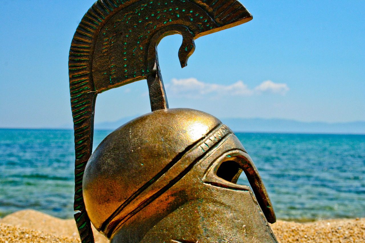 A helmet sitting on a beach