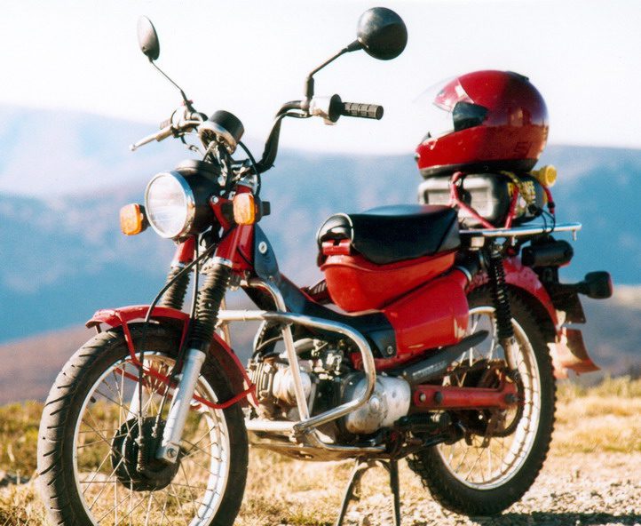 A Honda CT110 'Postie' bike in the Australian bush