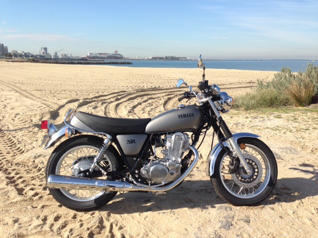 Yamaha SR400 has an In Any Sunday moment on the beach at Port Melbourne during the press launch