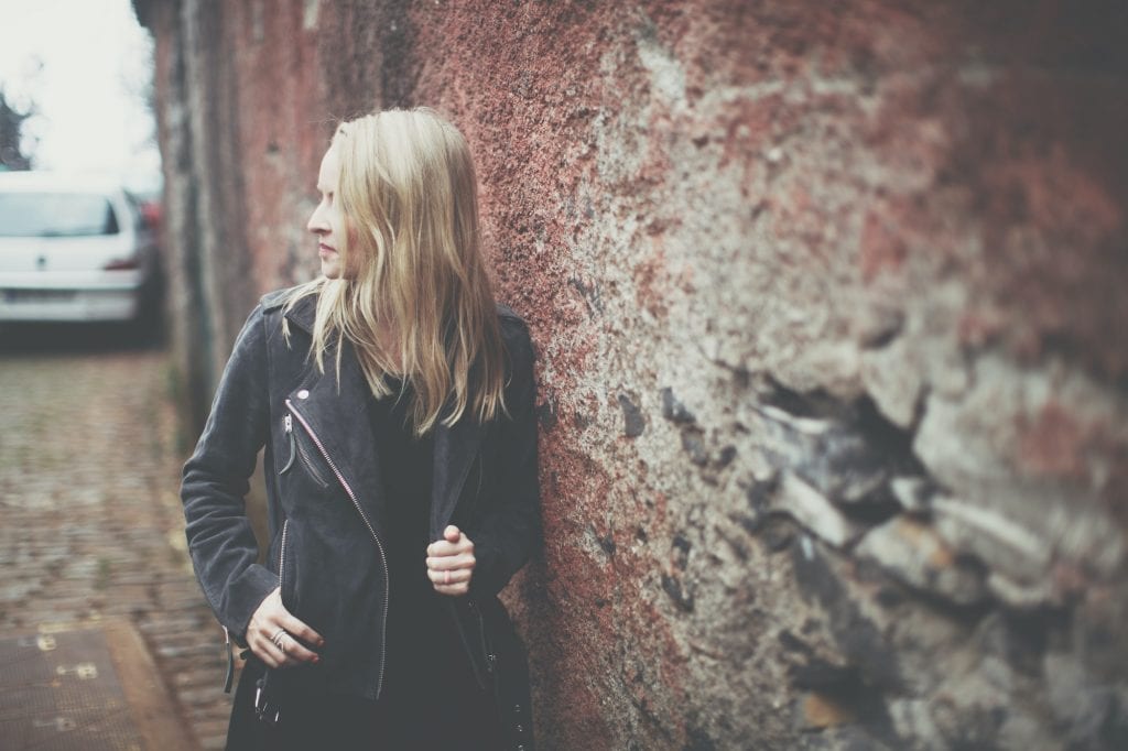 woman in leather jacket