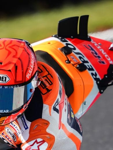 A view of racers on the MotoGP grid, doing what they do best. Media sourced from The-Race.