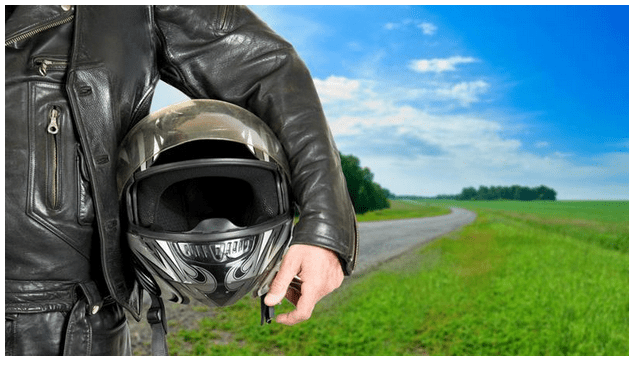 motorcycle helmet in hand for post