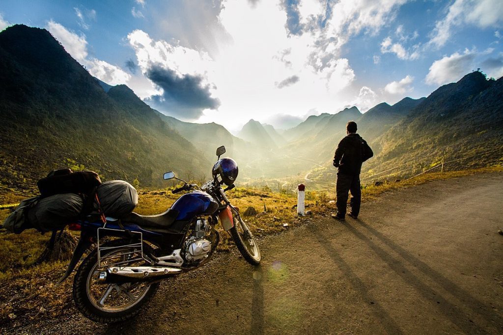 A view of a rider enjoying the view at a hilltop