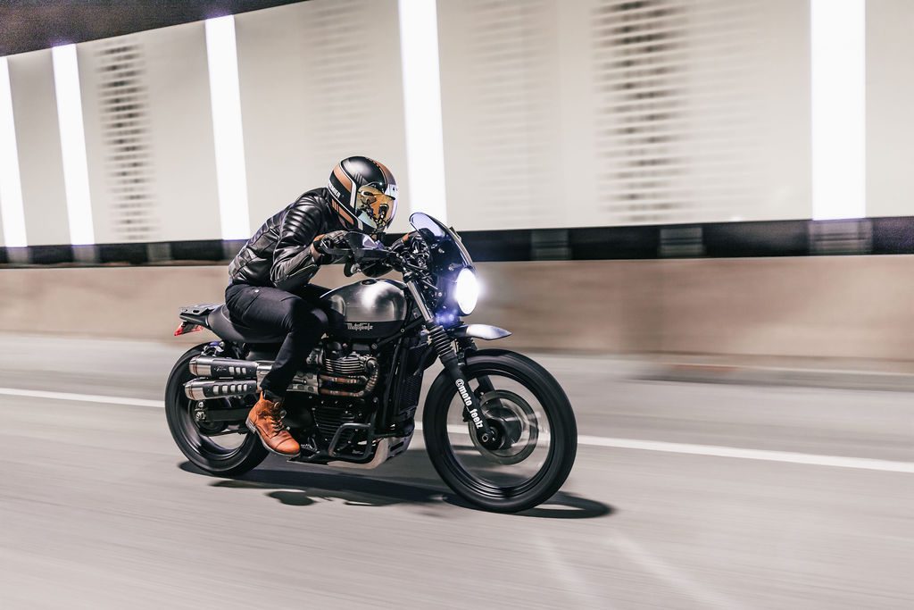 Motorcyclists rides through a tunnel